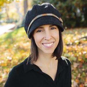 a woman in a black shirt with buttons